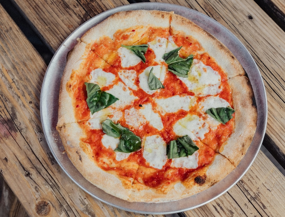 Fresh pizza on the table at a restaurant