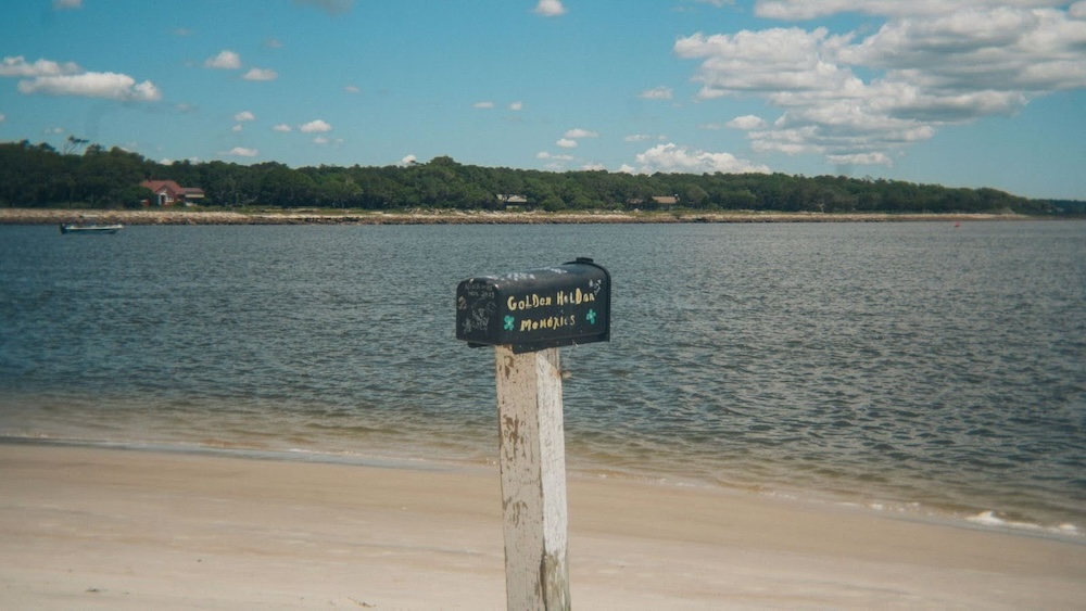 golden holden mailbox on the beach